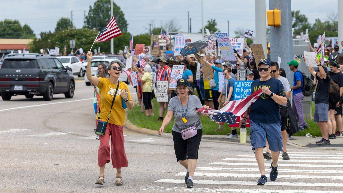 More than 1500 demonstrators lined Capital Boulevard to protest the policies and tactics of the of President Donald Trump on Saturday, June 14, 2025 near Triangle Town Center in Raleigh. The Raleigh “No Kings” rally was one of dozens across North Carolina and hundreds nationwide on what organizers called a nationwide day of defiance against the Trump administration.