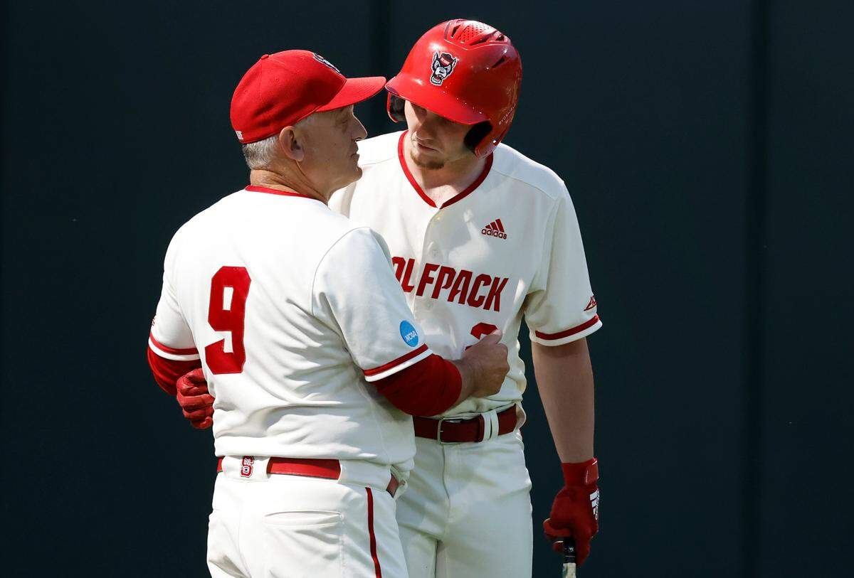 N.C. State head coach Elliott Avent talks with Noah Soles (2) in the eighth inning during N.C. State’s 6-4 victory over South Carolina in the NCAA Raleigh Regional at Doak Field Saturday, June 1, 2024.
