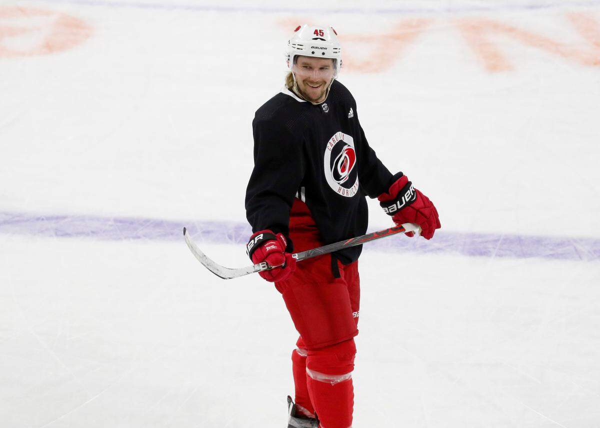 Carolina defenseman Sami Vatanen (45) smiles during the Carolina Hurricanes’ on-ice workouts at PNC Arena in Raleigh, N.C., Monday, July 13, 2020.
