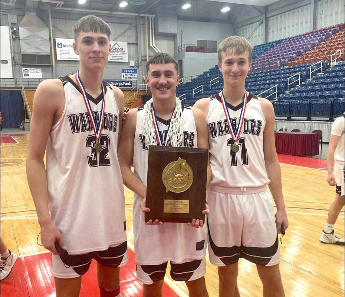 The Flagg brothers, from left, Cooper, Hunter and Ace, pose with the regional championship plaque after helping lead Nokomis High School of Newport, Maine, to the Class A East regional title at the Augusta Civic Center in February 2022. The Flaggs and Nokomis finished the season with a state title in Portland the following week.