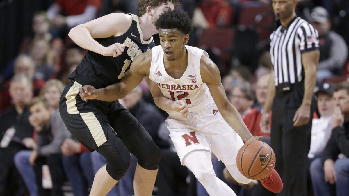 Nebraska’s Thomas Allen (12) drives around Purdue’s Ryan Cline (14) during the first half of an NCAA college basketball game in Lincoln, Neb., Saturday, Feb. 23, 2019.