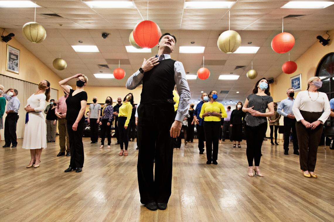 Ruslan Golovashchenko, center, the two-time Ukrainian ballroom dance champion, teaches a master class at Fred Astaire Dance Studio in Durham on Tuesday, March 1, 2022. Golovashchenko is stranded in Durham while his family escapes Kyiv.