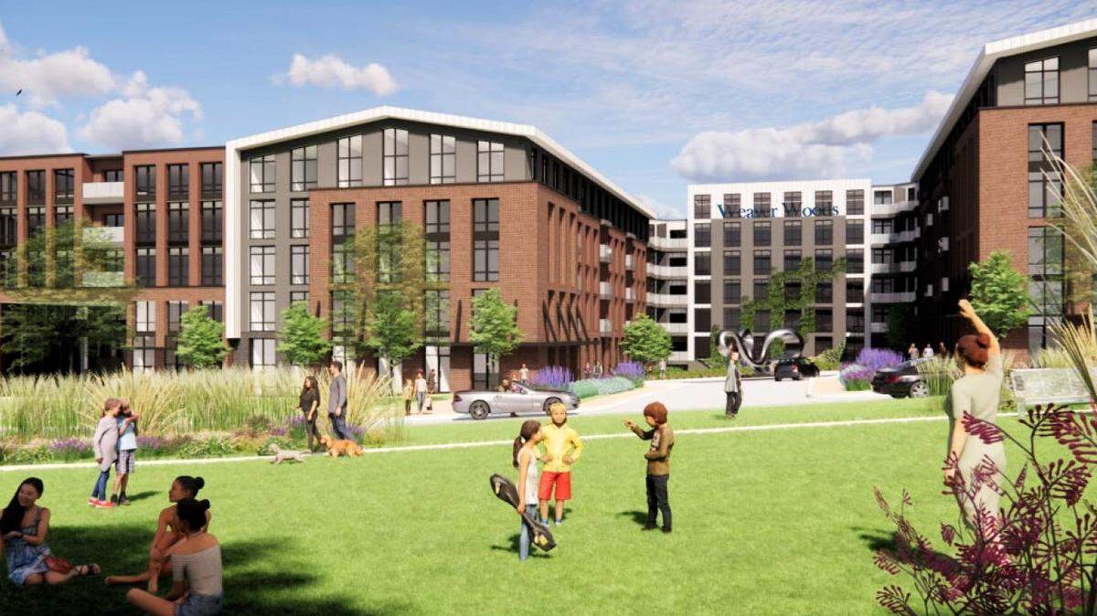 A previous rendering of the 860 Weaver Dairy project in Chapel Hill shows a grassy, public lawn in front of a five-story apartment building, with a six-story parking deck at the rear.