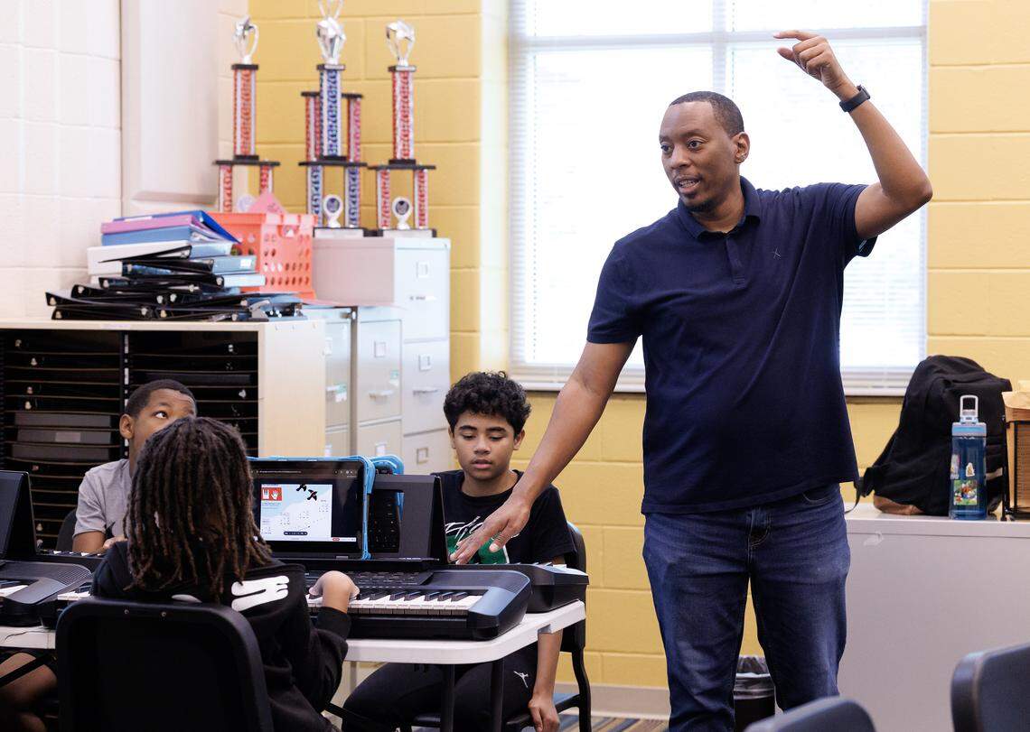 Chorus instructor Rahsaan McNeill speaks with students during a class on Friday, Aug. 15, 2025, at Neuse River Middle School in Raleigh, N.C.
