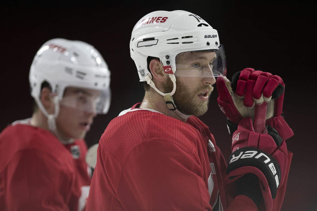 Already sporting a lengthy beard as the NHL playoffs begins, Carolina Hurricanes’ Jaccob Slavin listens to coach Rod Brind’Amour during practice on Tuesday, April 9, 2019 at PNC Arena in Raleigh, N.C.
