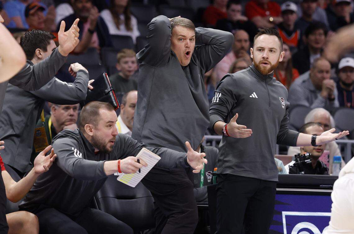 The Wolfpack assistant coaches can’t believe the call during the first half of N.C. State’s game against Virginia in the quarterfinals of the 2026 ACC Men’s Basketball Tournament at the Spectrum Center in Charlotte, N.C., Thursday, March 12, 2026.