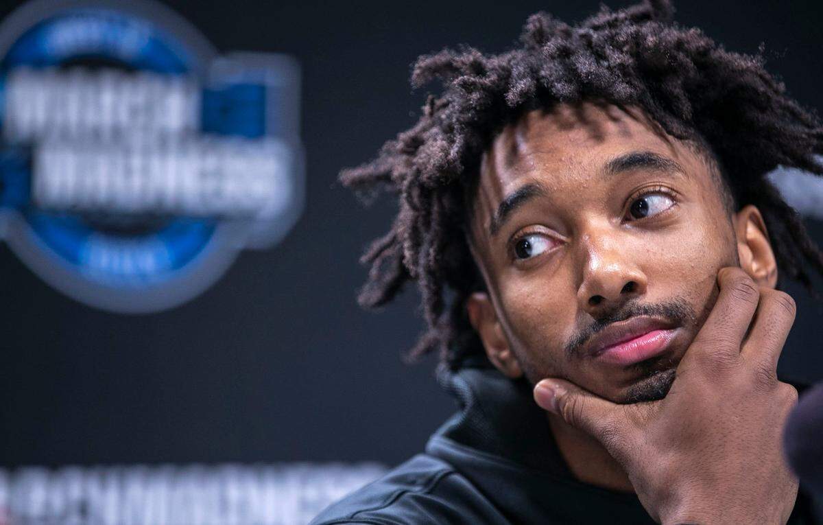 North Carolinas Leaky Black (1) listens at his teammate answer questions during a media availability on Thursday, March 24, 2022 at Wells Fargo Center in Philadelphia, Pa.