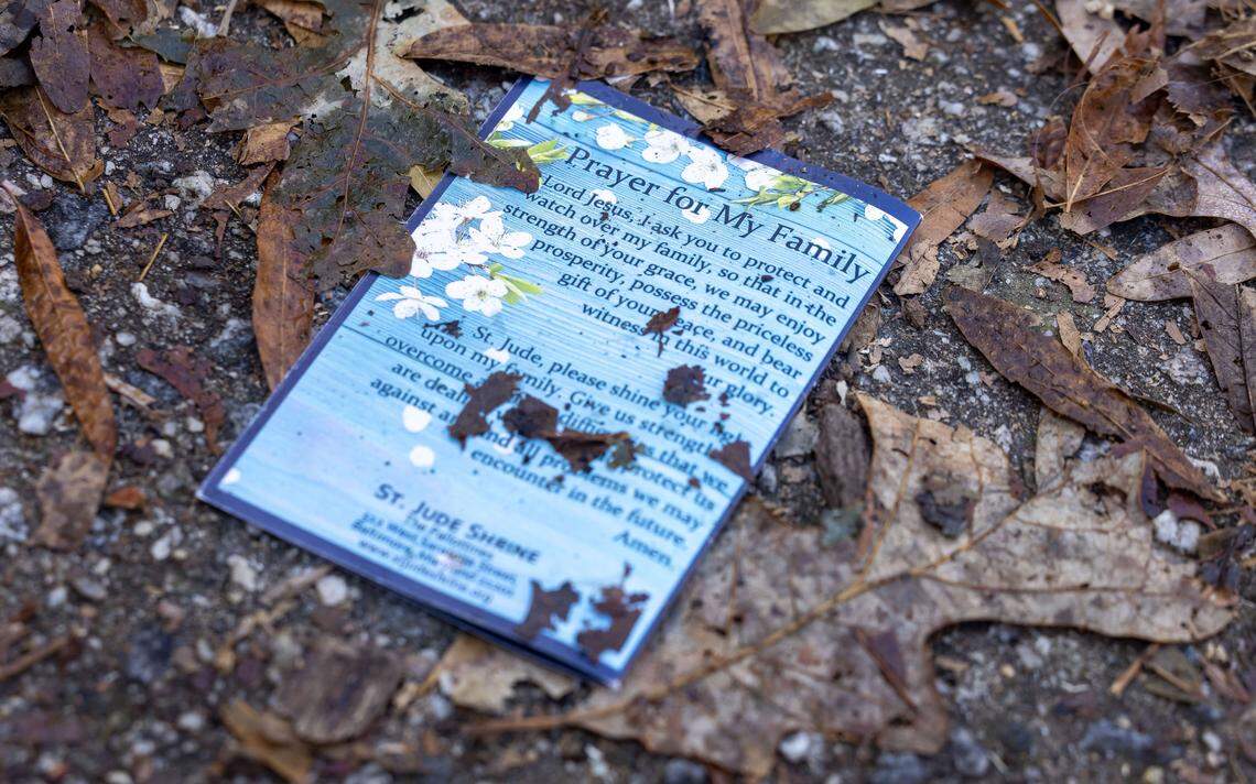 A prayer from a memorial for Zoe Welsh at 819 Clay Street, lies on the ground on Wednesday, Jan. 7, 2026, in Raleigh, N.C. 