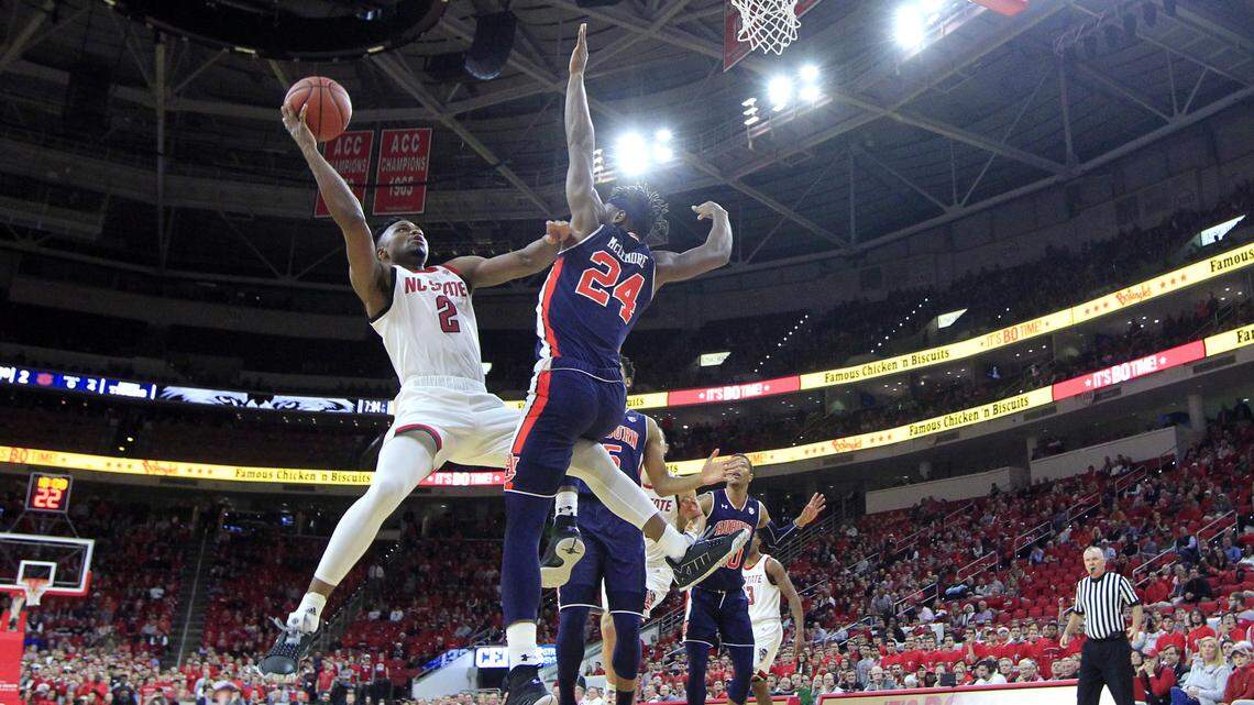 N.C. State’s Torin Dorn (2) shoots as Auburn’s Anfernee McLemore (24) defends during N.C. State’s 78-71 victory over Auburn at PNC Arena in Raleigh, N.C., Wednesday, Dec. 19, 2018.