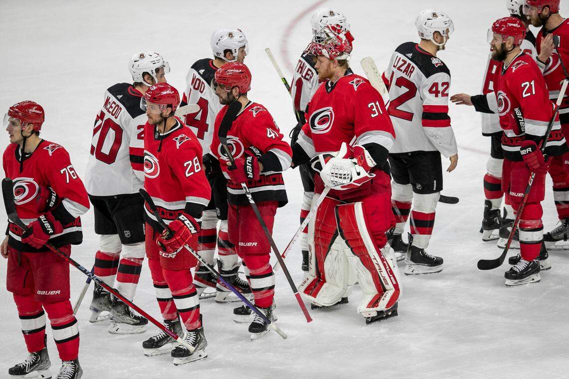 The New Jersey Devils Miles Wood (44) congratulates Carolina Hurricanes goalie Frederik Andersen (31) in the handshake line, following the Hurricanes’ 3-2 overtime victory in Game 5 of their second round Stanley Cup playoff series on Thursday, May 11, 2023 at PNC Arena in Raleigh, N.C.