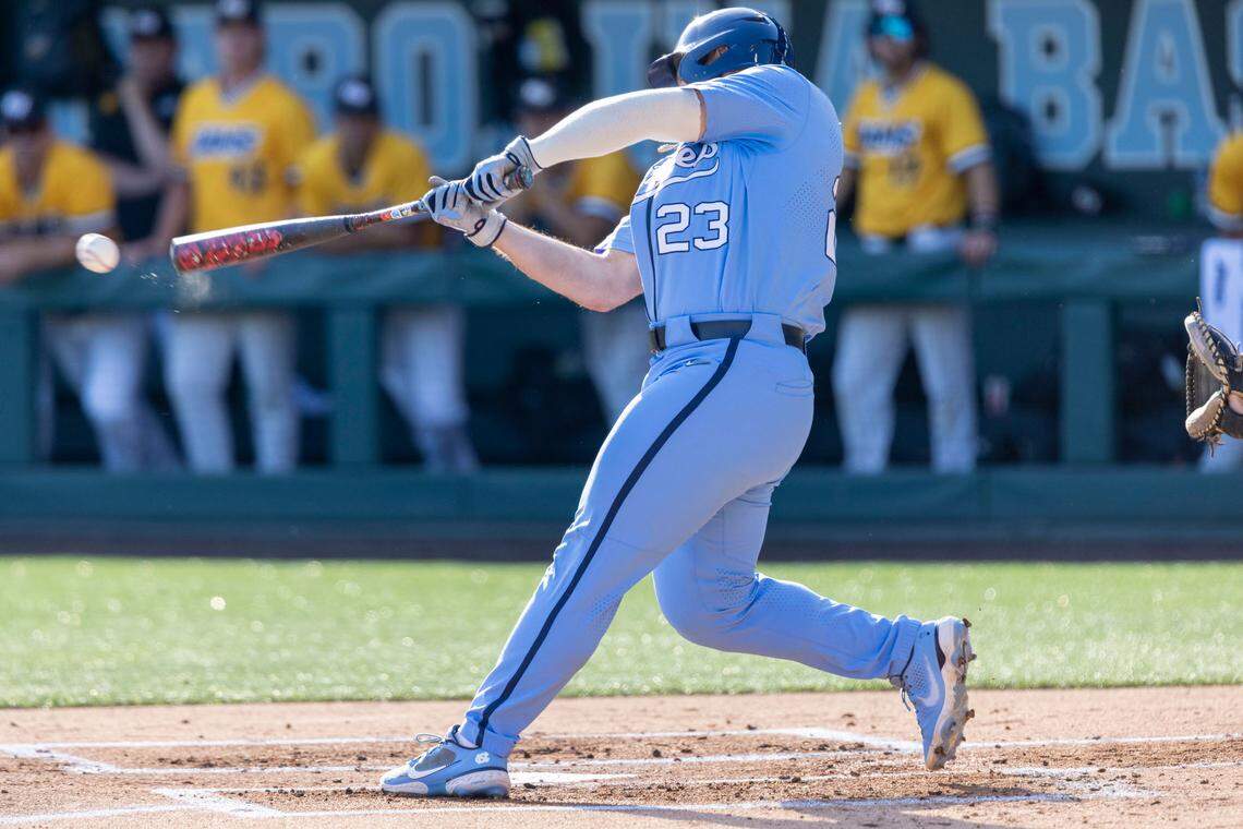 North Carolina’s Alberto Osuna (23) connects for a single to center field scoring teammate Danny Serretti to give the Tar Heels’ a 1-0 lead over VCU in the first inning against VCU on Monday, June 6, 2022 during during the NCAA Regional championship at Boshamer Stadium in Chapel Hill, N.C.