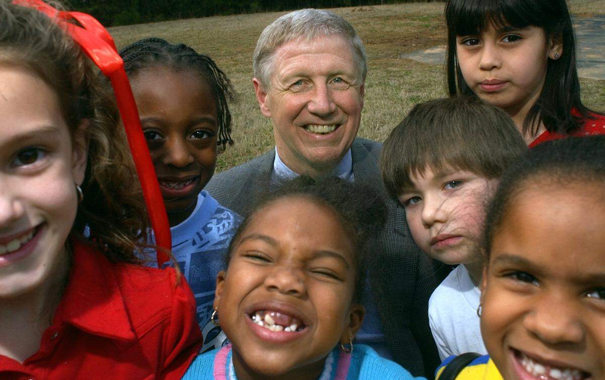 Ralph Capps, with some of the children who are part of the Boys & Girls Clubs of Wake County, in this 2003 file photo. Capps died on Nov. 17, 2023 after 50 years leading the organization.