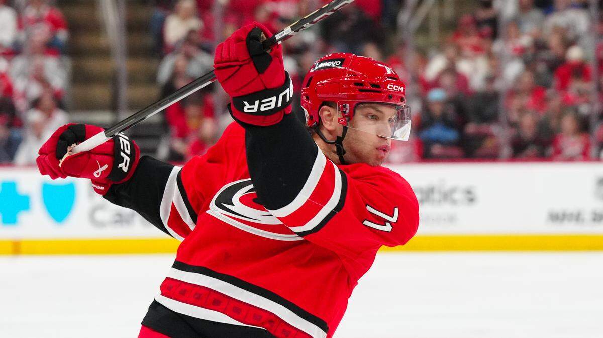 Mar 14, 2025; Raleigh, North Carolina, USA; Carolina Hurricanes left wing Taylor Hall (71) takes a shot against the Detroit Red Wings during the third period at Lenovo Center. Mandatory Credit: James Guillory-Imagn Images