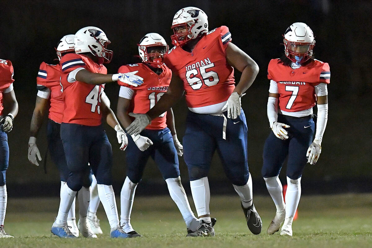 Jordan lineman Noah Clark (65) congratulates teammates after the touchdown during the first half against Apex Friendship. The Apex Friendship Patriots and the Durham Jordan Falcons met in the second round of the NCHSAA 4A playoffs in Durham, N.C. on November 22, 2024.