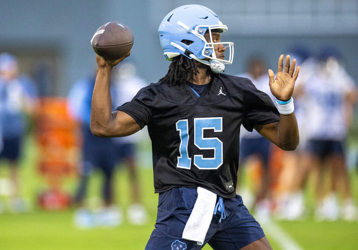 North Carolina quarterback Conner Harrell (15) looks for an open receiver during the Tar Heels’ first practice of the season on Monday, July 29, 2024 in Chapel Hill, N.C.