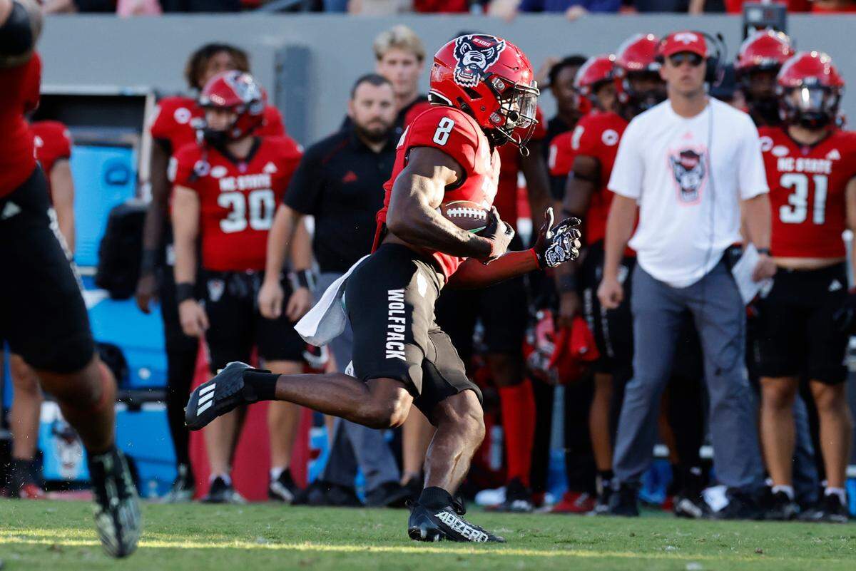 N.C. State defensive back Robert Kennedy (8) runs back an interception during the second half of N.C. State’s 48-41 victory over Marshall at Carter-Finley Stadium in Raleigh, N.C., Saturday, Oct. 7, 2023.