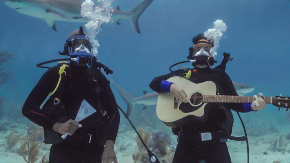 JB Smoove, left, and Brad Paisley, right, in the Shark Week 2021 special “Brad Paisley’s Shark Country.”