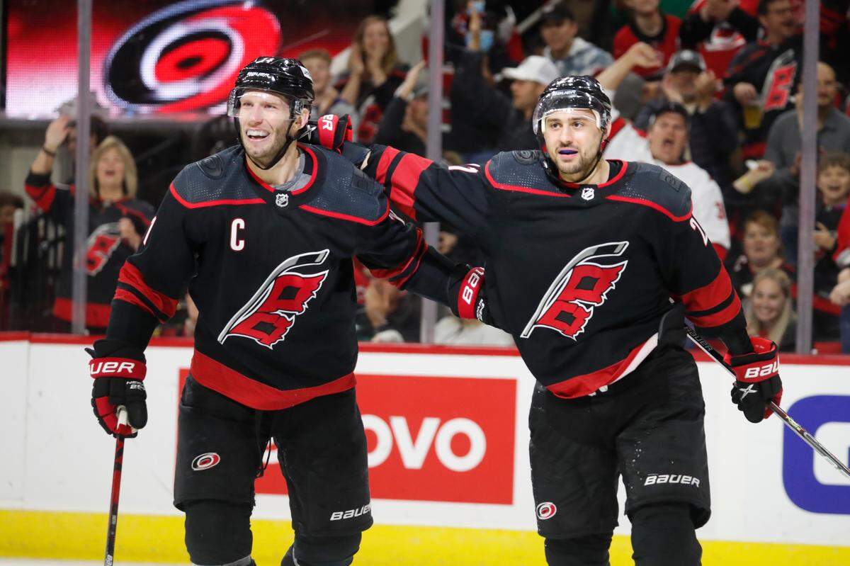 Carolina Hurricanes’ Nino Niederreiter, right, celebrates his goal with Jordan Staal during the second period of the team’s NHL hockey game against the Dallas Stars in Raleigh, N.C., Thursday, March 24, 2022. (AP Photo/Karl B DeBlaker)