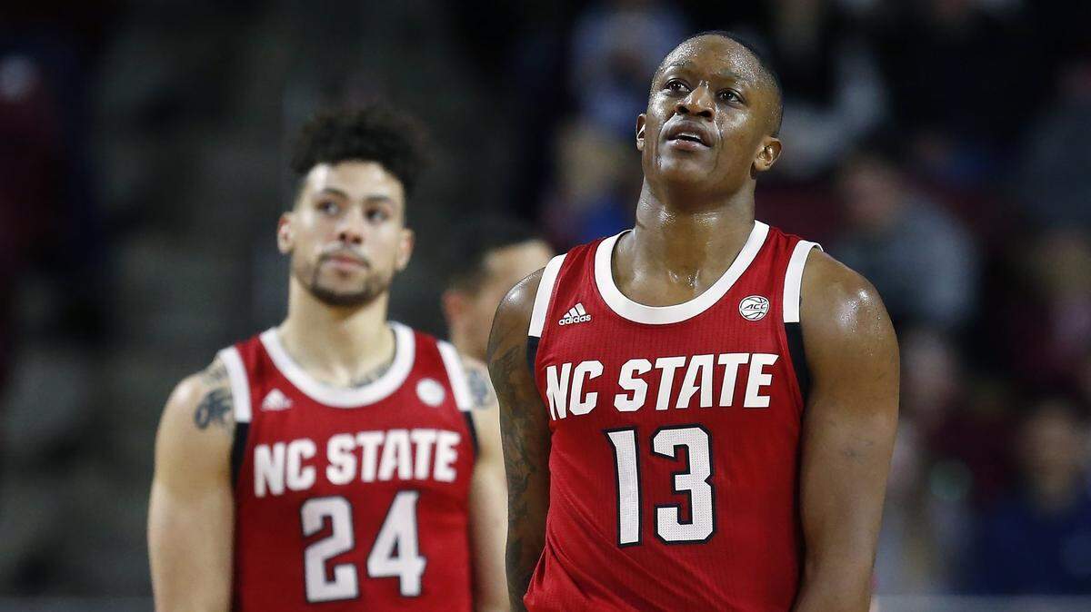 North Carolina State’s C.J. Bryce (13) and Devon Daniels (24) react during the second half of an NCAA college basketball game against Boston College in Boston, Sunday, Feb. 16, 2020.
