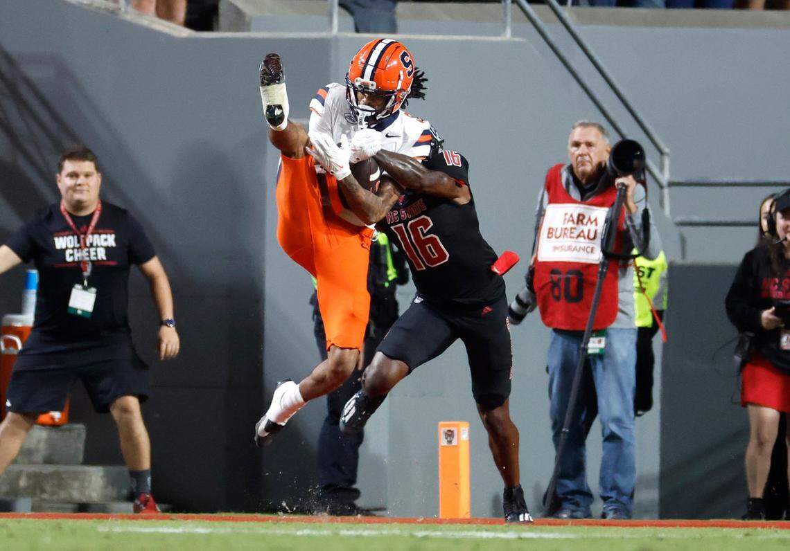 Syracuse wide receiver Umari Hatcher (5) pulls in a 28-yard reception while defended by N.C. State cornerback Devon Marshall (16) during the first half of N.C. State’s game against Syracuse at Carter-Finley Stadium in Raleigh, N.C., Saturday, Oct. 12, 2024.