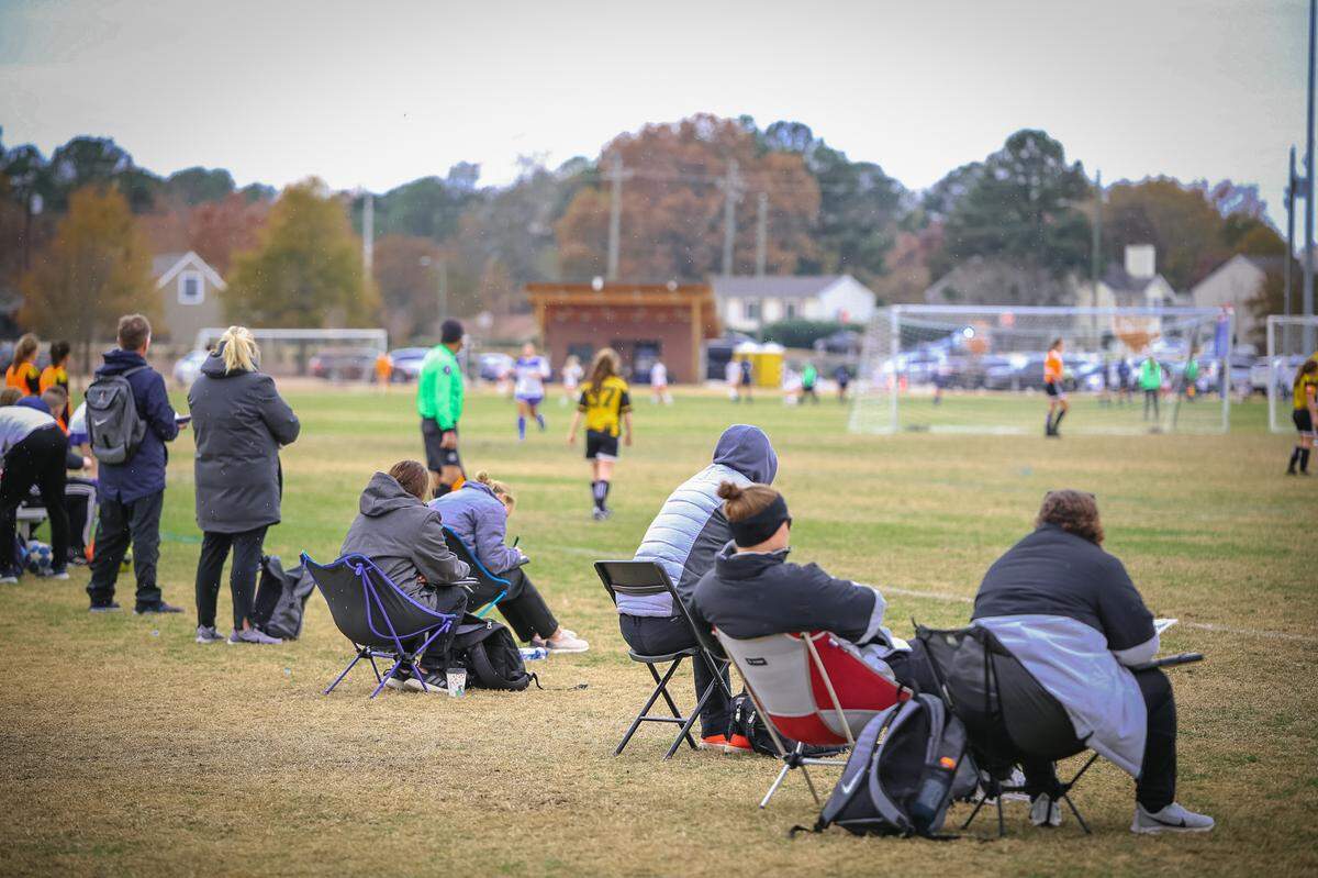 Spectators gather to watch 2019 Girls College Showcase. Because of COVID-19 concerns, spectators will be limited to 100 per field in 2020.