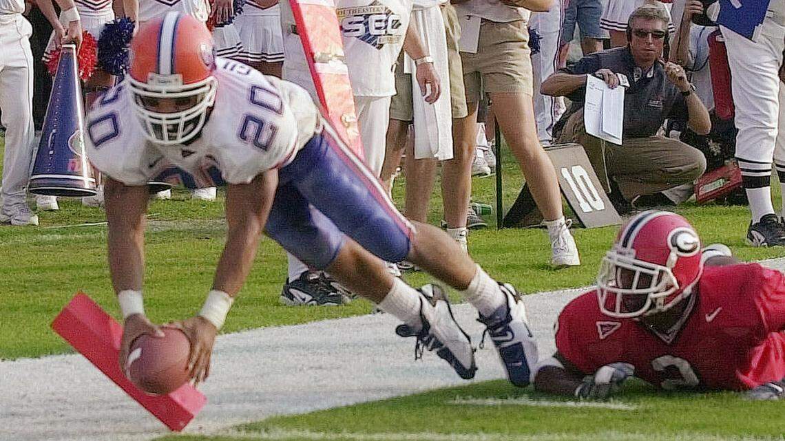 Florida tailback Robert Gillespie (20), who was named to North Carolina's coaching staff on Wednesday, scores a touchdown for Florida against Georgia in 2000.