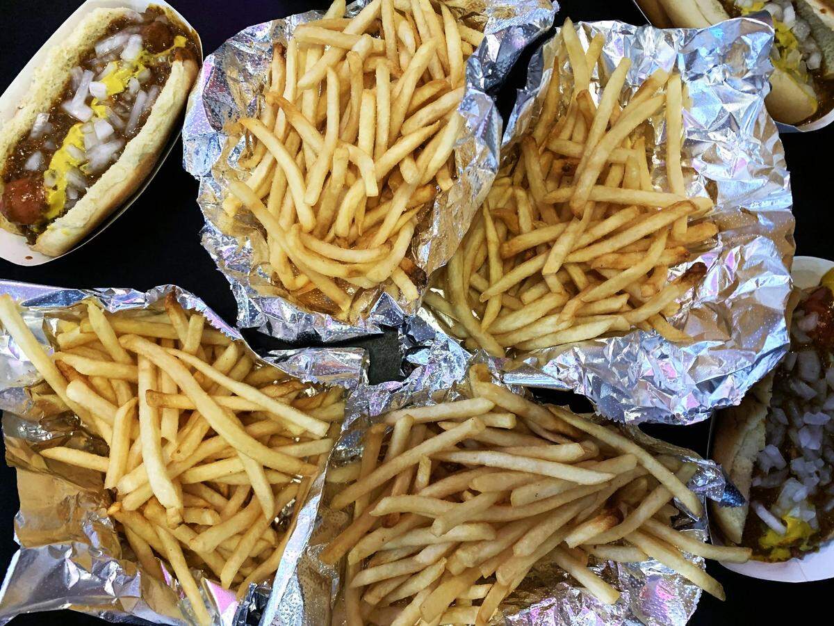 Four orders of fries at Cloos’ Coney Island arrive on sheets of aluminum foil. Cloos’ might serve Raleigh’s most perfect french fry.
