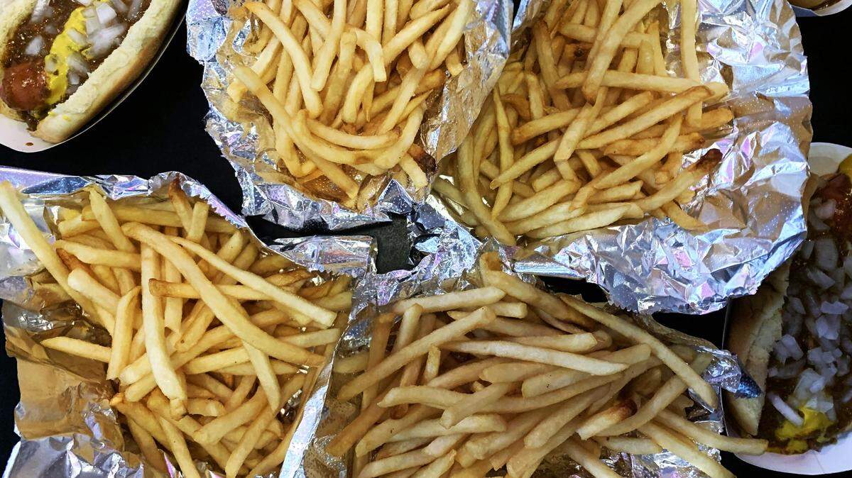 Four orders of fries at Cloos’ Coney Island arrive on sheets of aluminum foil. Cloos’ might serve Raleigh’s most perfect french fry.