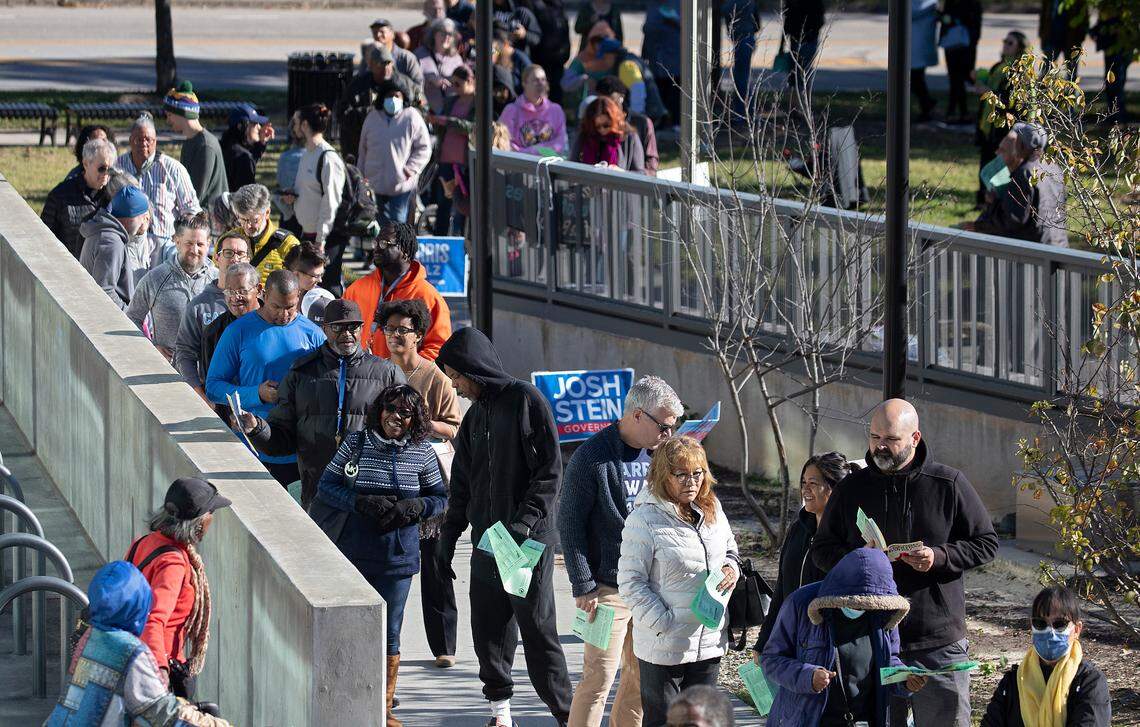 People line up to vote outside the Durham County Main Library in Durham, N.C., Thursday morning, Oct. 17, 2024, on first day of early voting in North Carolina. There are more than 400 early voting sites across the state. During the early voting period, voters can visit any early voting site in their county. While on Election Day, voters must visit their assigned polling place.