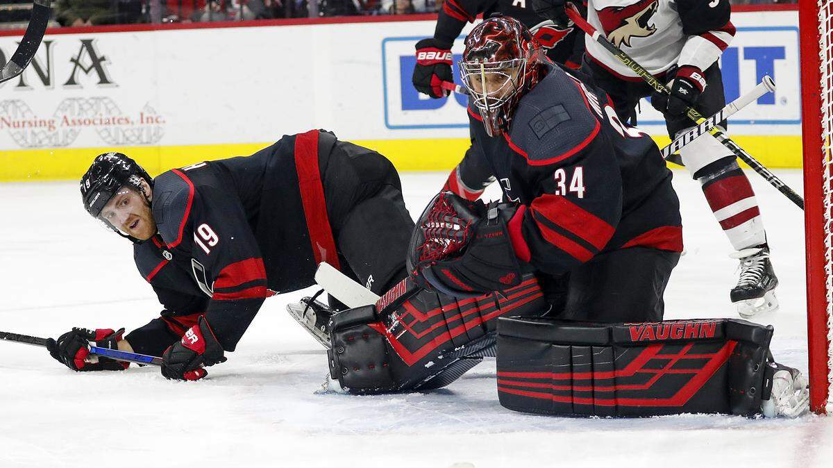 Carolina Hurricanes goalie Petr Mrazek (34) eyes the puck as it travels wide of the net during his 3-0 shutout of the Arizona Coyotes on Friday.