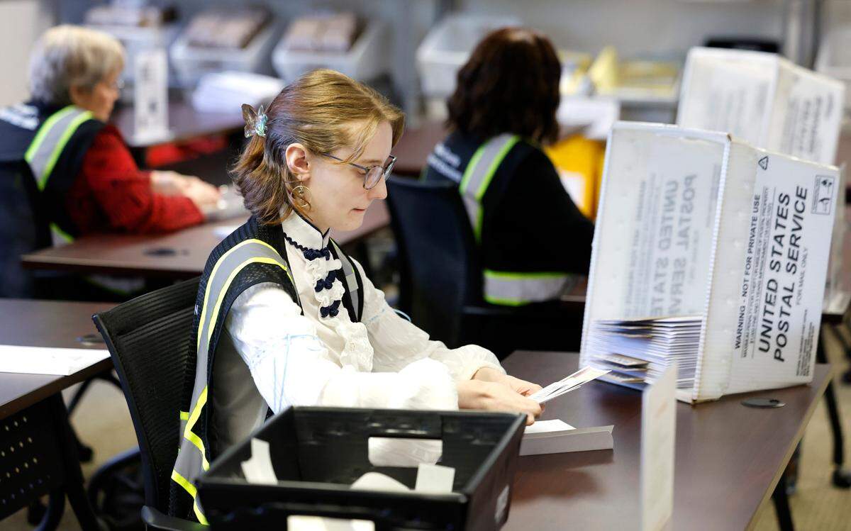 Absentee ballots are prepared to be sent out at the Wake County Board of Elections Operations Center in Raleigh, N.C., Tuesday, Oct. 8, 2024.