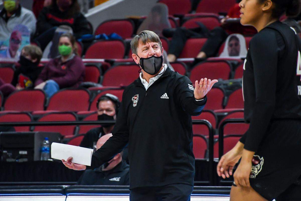 N.C. State head coach Wes Moore motions to his players during the Wolfpack’s game against Louisville at KFC Yum! Center in Louisville, Ky. Monday, February 1, 2021.
