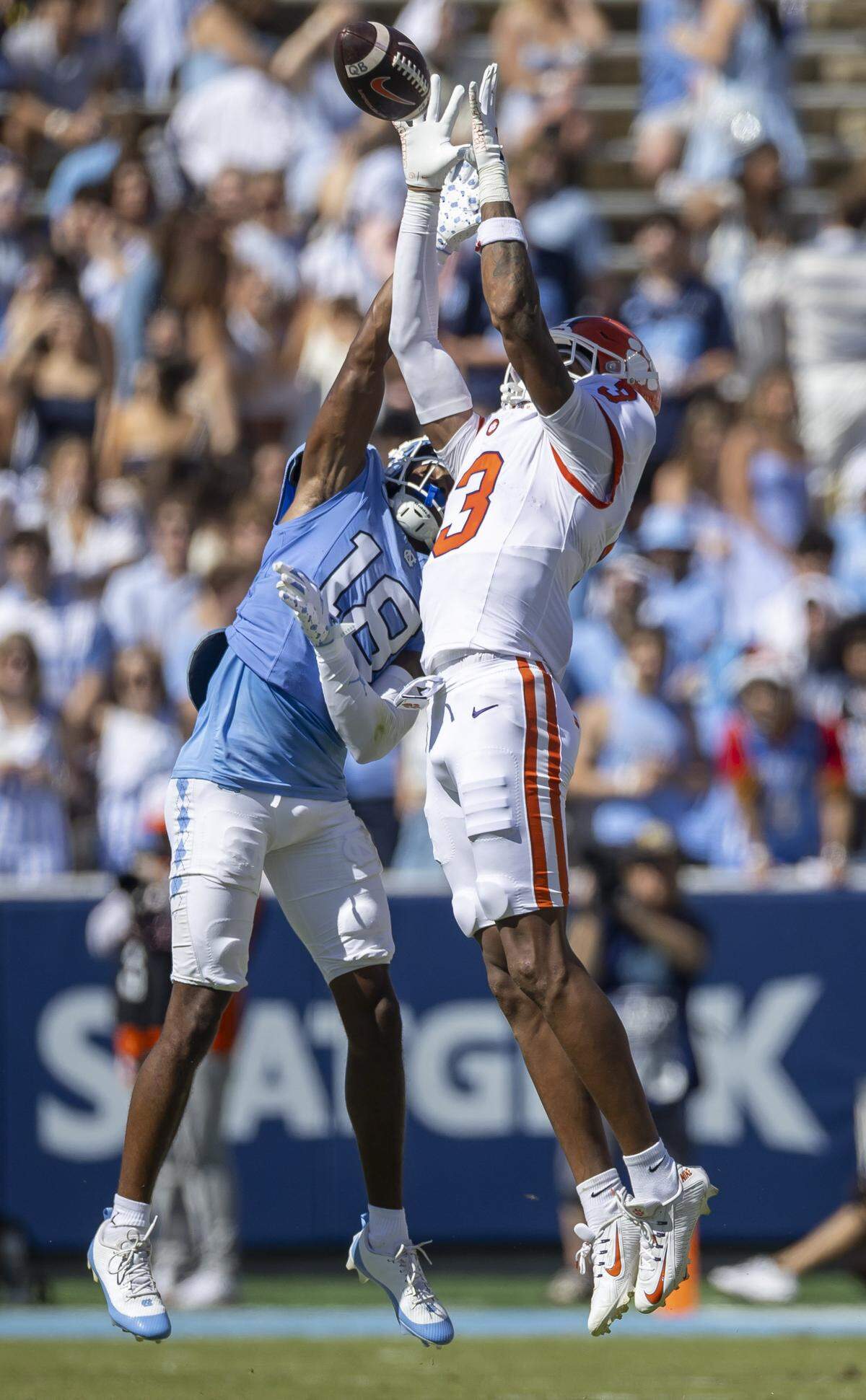 Clemson wide receiver Tristan Smith (3) pulls in a pass from quarterback Cade Klubnik over North Carolin defensive back Jaiden Patterson (18) for a 19-yard gain in the second quarter on Saturday, October 4, 2025 at Kenan Stadium in Chapel Hill, N.C. 