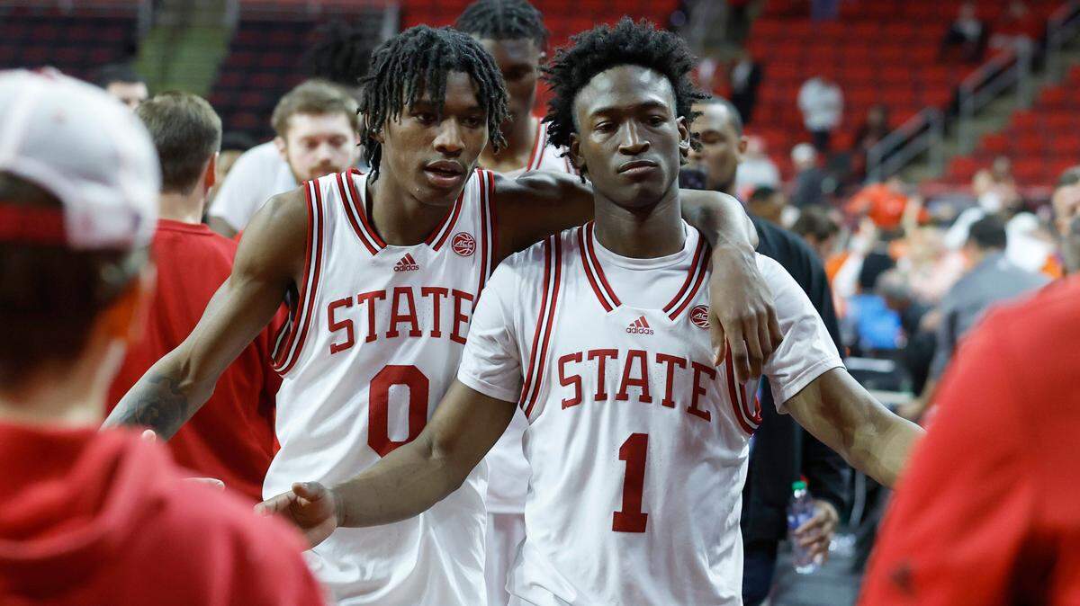 N.C. State’s Terquavion Smith (0) and Jarkel Joiner (1) walk off the court after Clemson’s 96-71 victory over N.C. State’s game at PNC Arena in Raleigh, N.C., Saturday, Feb. 25, 2023.