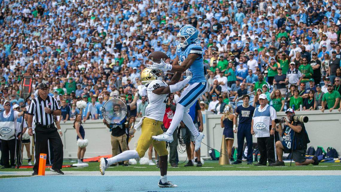 North Carolina’s Josh Downs (11) scores on a four yard pass from quarterback Drake Maye to give the Tar Heels’ a 7-0 lead in the first quarter against Notre Dame on Saturday, September 24, 2022 at Kenan Stadium in Chapel Hill, N.C.