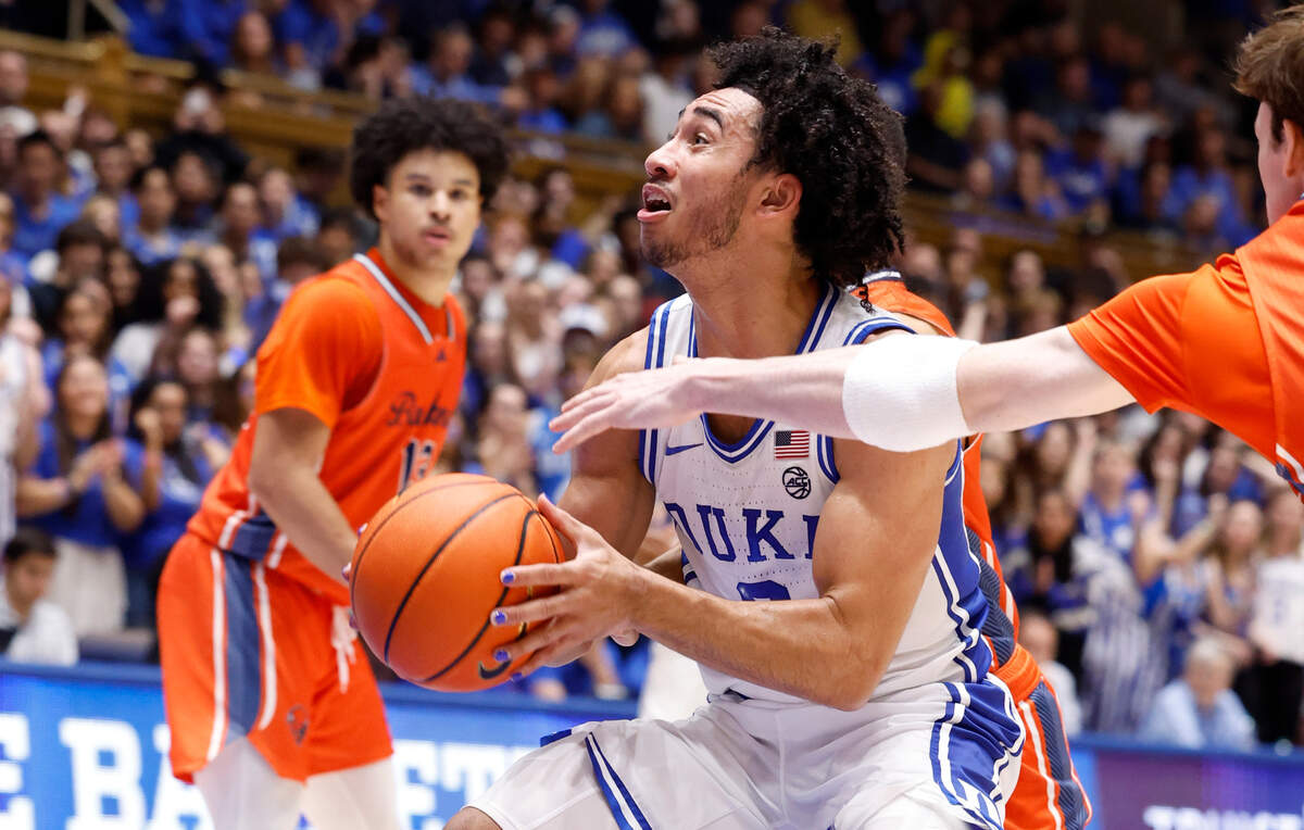 Duke’s Jared McCain (0) drives to the basket past Bucknell’s Ian Motta (1) during the second half of Duke’s 90-60 victory over Bucknell at Cameron Indoor Stadium in Durham, N.C., Friday, Nov. 17, 2023.