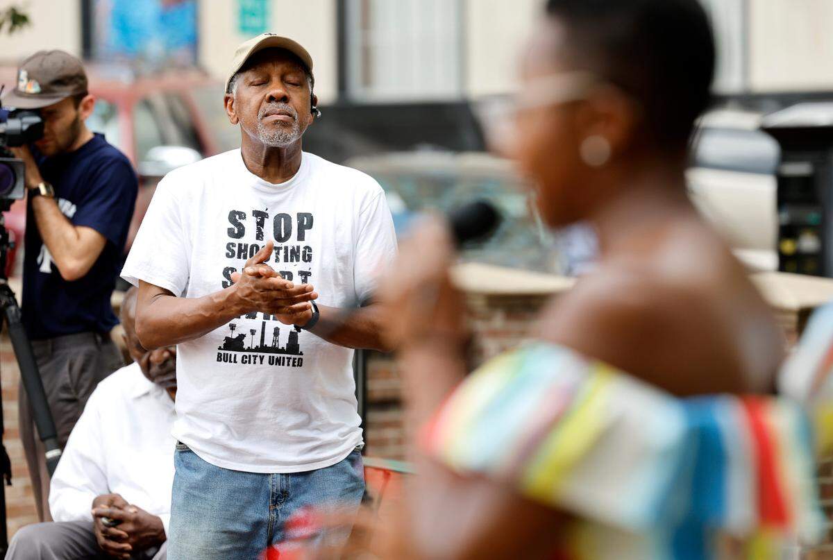 Tony Williams listens during a prayer vigil at CCB Plaza in Durham, N.C., Thursday, July 6, 2023. This week marked a grim milestone in Durham as gun violence claimed its youngest victim so far this year: 5-year-old Khloe Fennell. Khloe was one of two young people shot Wednesday afternoon. Shea Ramirez, a local activist who organized Thursday’s event, said she felt called to host a community prayer event after she heard about Khloe’s death.