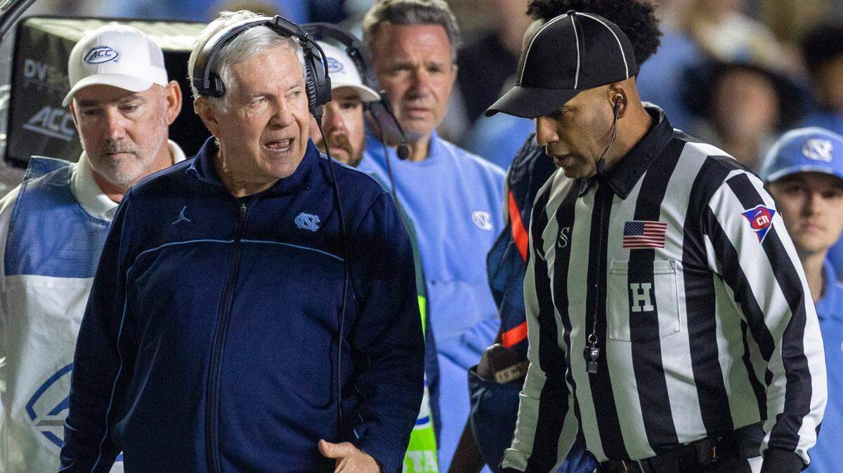 North Carolina coach Mack Brown argues a call with official Brian Perry in the second quarter against Virginia on Saturday, October 21, 2023 at Kenan Stadium in Chapel Hill, N.C.