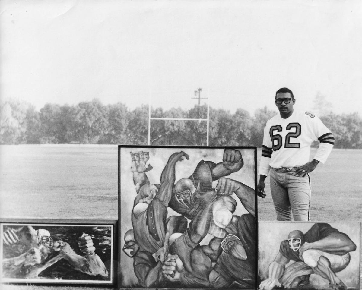 Ernie Barnes with his paintings on the movie set "Number One" starring Charlton Heston in 1969.