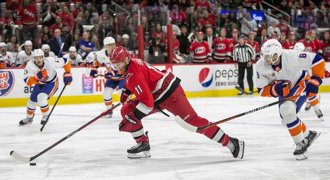The Carolina Hurricanes Jordan Staal (11) breaks ahead of the New York Islanders Noah Dobson (8) in the first period during Game 5 of their Stanley Cup series on Tuesday, April 25, 2023 at PNC Arena in Raleigh, N.C.