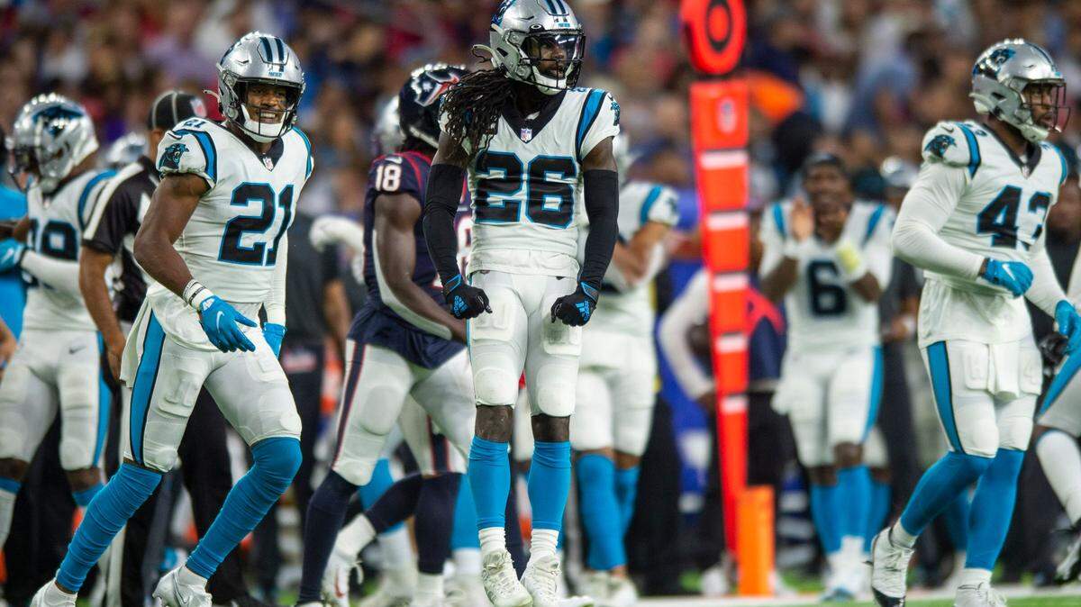Panthers cornerback Donte Jackson, center, celebrates after a defensive stop during the game against the Texans at NRG Stadium on Thursday, September 21, 2021 in Houston, TX. The Panthers beat the Texans 24-9, giving them their third win in a row to start the season.