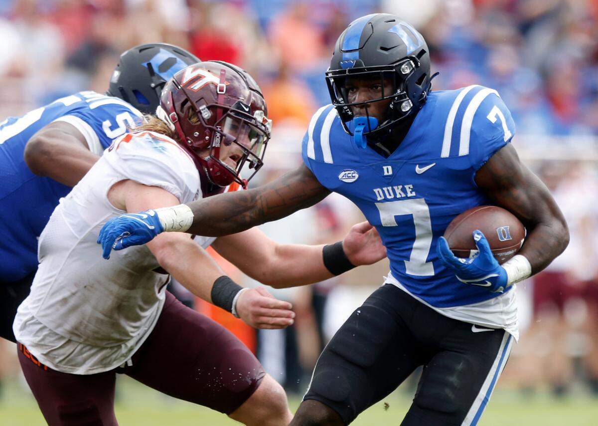 Duke running back Jordan Waters runs the ball during the second half of the Blue Devils’ game against the Virginia Tech Hokies at Wallace Wade Stadium on Saturday, Nov. 12, 2022, in Durham, N.C.