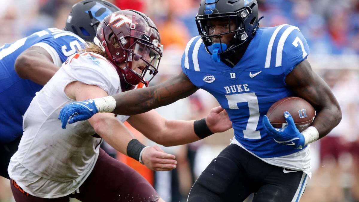 Duke running back Jordan Waters runs the ball during the second half of the Blue Devils’ game against the Virginia Tech Hokies at Wallace Wade Stadium on Saturday, Nov. 12, 2022, in Durham, N.C.
