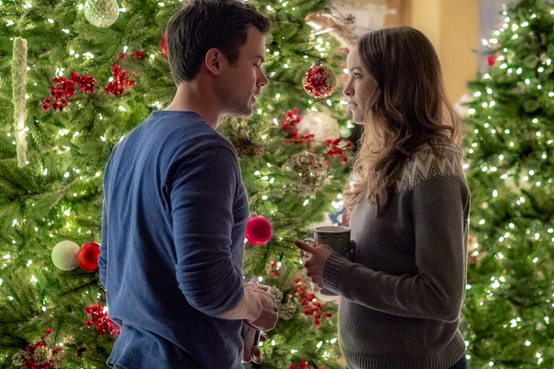 Matt Long, left, and Danielle Panabaker in the Hallmark movie “Christmas Joy.”
