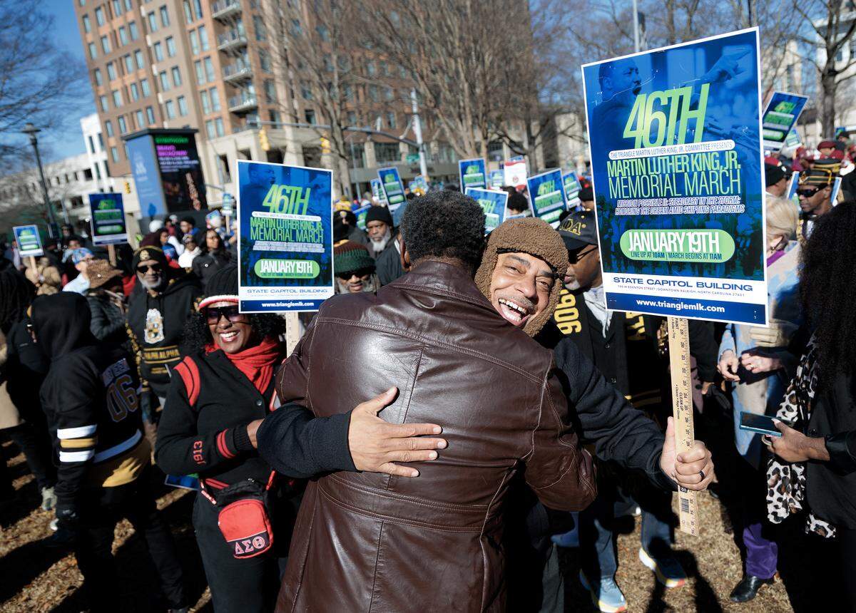 Gregory Lewis receives a hug at the conclusion of the 46th Annual Martin Luther King Jr. Memorial March on Monday, Jan. 19, 2026, in Raleigh, North Carolina.