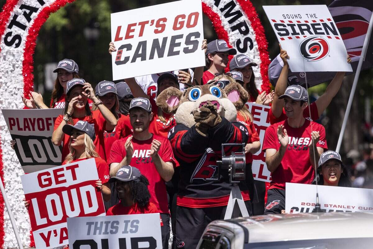 Thousands of Carolina Hurricanes fans gather in downtown Raleigh on Saturday, June 20, 2026, during a parade and rally celebrating the Hurricanes' Stanley Cup Final victory over the Vegas Golden Knights. The Hurricanes won the series 4-2 to capture the Stanley Cup for the second time since 2006.