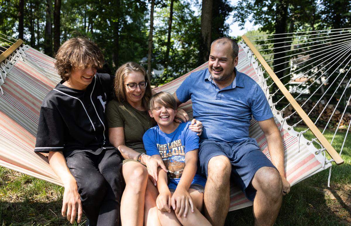 The Dumas family poses for a portrait at their home in Huntersville, N.C., on Wednesday, June 28, 2023.
