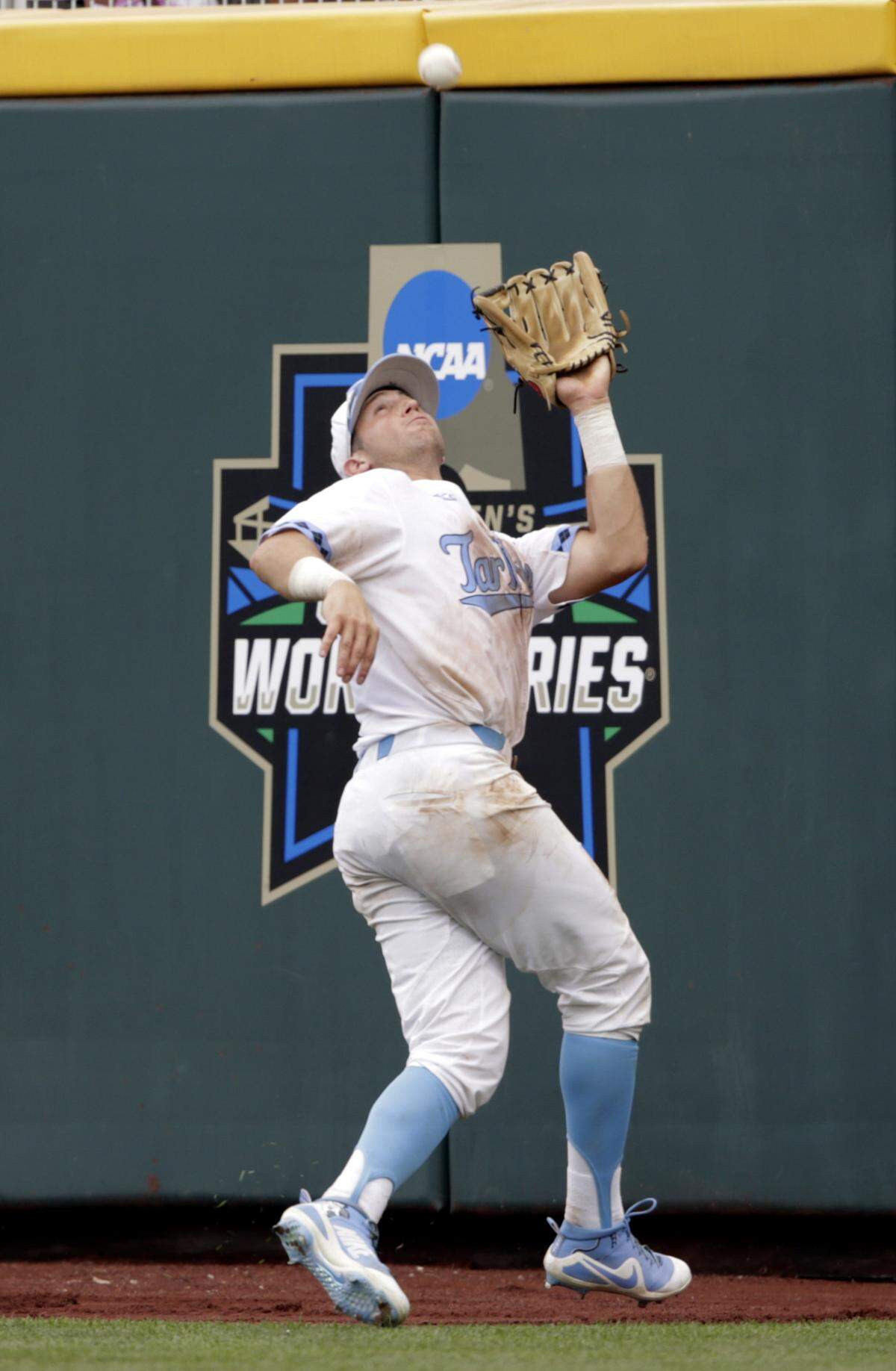 North Carolina right fielder Cody Roberts catches a fly ball hit by Mississippi State's Jake Mangum (15) in the eighth inning in Omaha, Neb., Tuesday, June 19, 2018. Mississippi State won 12-2.
