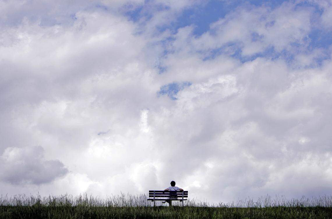 A walker takes a short break to sit on the bench and enjoy the view at Shelley Lake in Raleigh. Shelley Lake off Millbrook Road provides 2 miles of lake-encircling paved trails and plenty of grassy areas to spread out on.