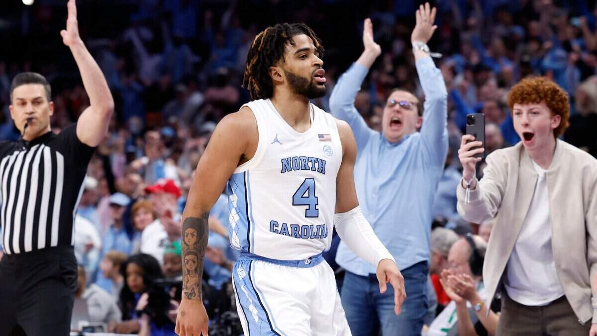 North Carolina’s RJ Davis (4) celebrates making a three-pointer during the first half of N.C. State’s game against UNC in the championship game of the 2024 ACC Men’s Basketball Tournament at Capital One Arena in Washington, D.C., Saturday, March 16, 2024.